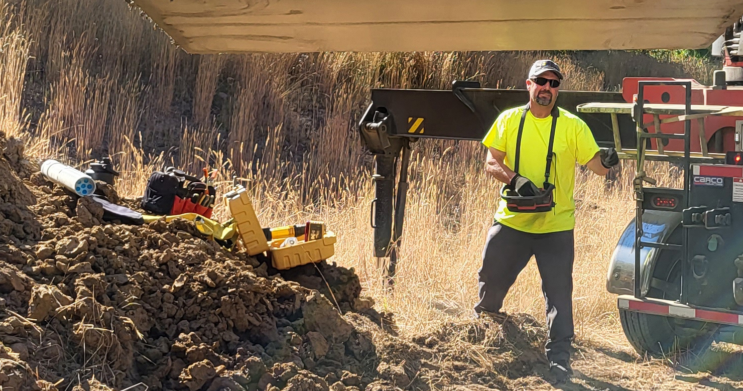 Fulcrum Contracting crew member on a job site installing a septic system