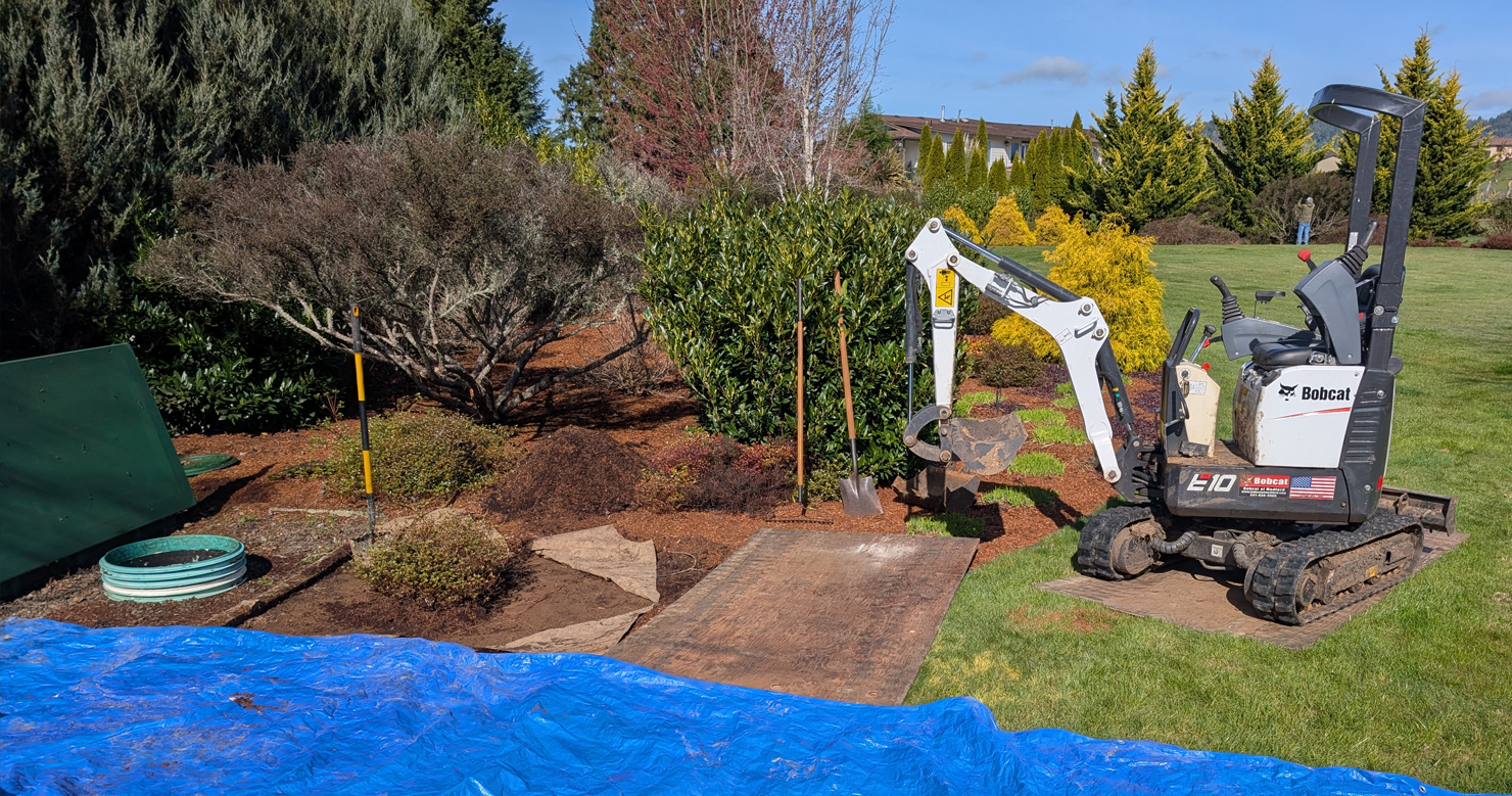 Reparing a septic issue in a residential yard in Douglas County, OR